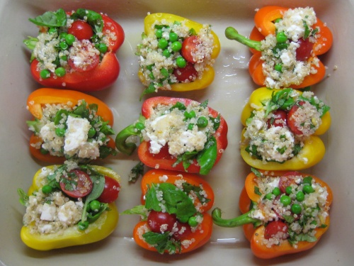 Stuffed peppers with quinoa, feta, cherry tomatoes and peas